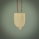 Hand carved Wheku pendant. Carved from woolly mammoth ivory by NZ Pacific. Hand crafted Mammoth tusk jewellery for sale online.