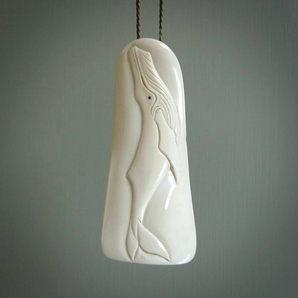 Hand carved humpback whale pendant, carved by us. This piece is carved from cow bone and is a fantastic depiction of these giants of the deep. This particular piece is a humpback whale design and is lovingly carved.