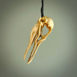 This is a hand carved deer antler huia bird skull pendant. It is made from deer antler, bone. This is a large sized necklace and is a very unique, one only, pendant that is a collectors piece. Hand carved deer antler huia skull necklace for men and women.