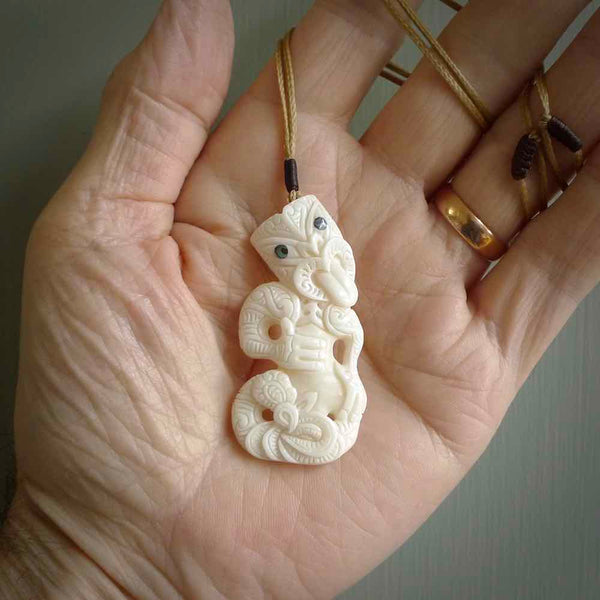 Hand carved tiki. Tiki Pendant made from cow bone by NZ Pacific. Ethnic handcarved jewellery for sale online.