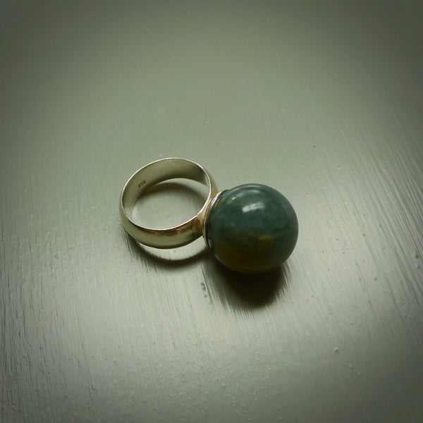 Hand carved jade ball ring with sterling silver. Carved for NZ Pacific by Ana Krakosky here in New Zealand. Carved from real Guatemalan Jade and Sterling Silver. This is a one only ring available, delivered with DHL Express Courier.