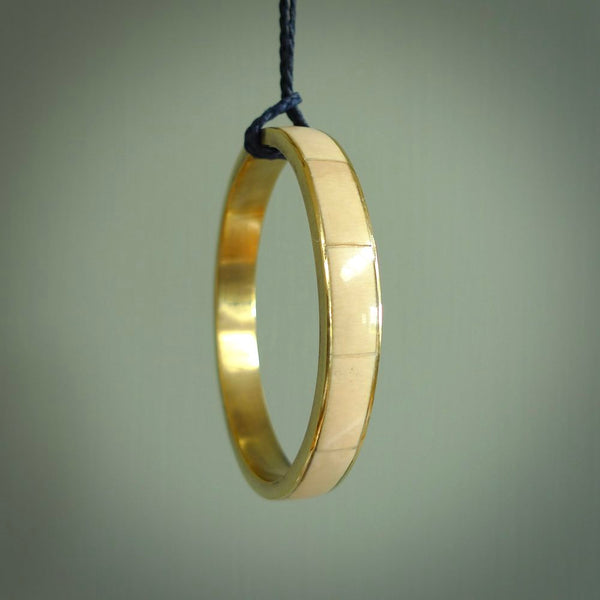 This piece is a hand made bracelet. It is made from selected pieces of woolly mammoth tusk which we have cut and polished and then inset into a brass bracelet. It is a very striking piece one of a kind and truly beautiful.