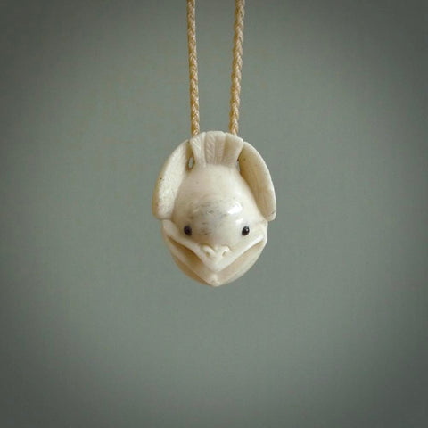 Hand carved stellar intricate little fantail carving. A stunning work of art. This pendant was hand carved by Fumio Noguchi, in Bone. A one off collectors item that has been hand crafted to be worn or displayed.