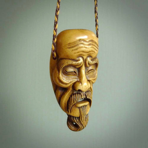 A spectacular piece of wearable art for all lovers of traditional play masks, Japanese culture and just very fine carving! KAGEKIYO is a magnificent carving, hand crafted from Deer antler and stained with a dye that Fumio makes specifically for this purpose.
