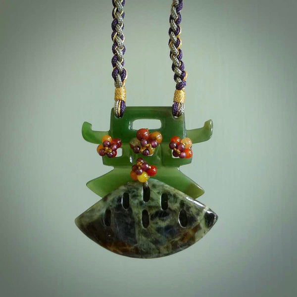 Hand carved contemporary asian design temple pendant from New Zealand Jade with colourful beads and adjustable cord. This piece is a stand out work of creativity and skill and we love Jen Hung's beautifully coloured cords. Unique, one only, New Zealand made necklace for sale. Free shipping worldwide.