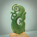 Hand carved New Zealand Jade Manaia sculpture with wooden stand. This is a large New Zealand Flower Jade Manaia sculpture hand carved here in New Zealand. This is a one only work of art and will be shipped to you with express courier.