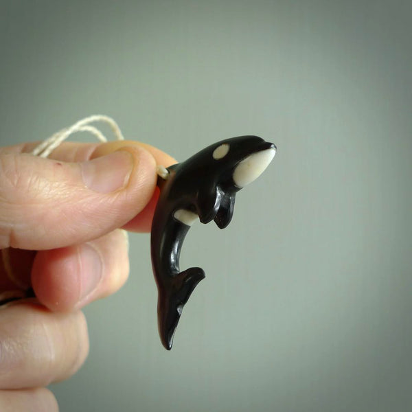 Hand carved black jade Orca pendant. Ocean themed pendants hand carved from natural materials by NZ Pacific. Unique handmade jewellery.