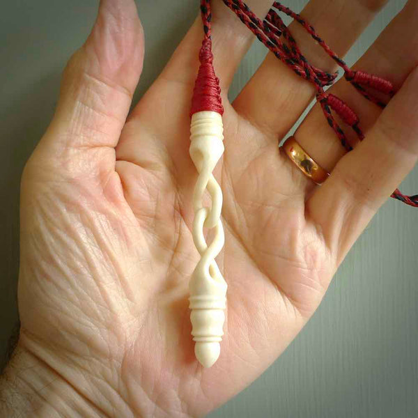 A handcarved masterpiece. A complex large twist pendant carved from bone by Yuri Terenyi for NZ Pacific. This is a true piece of wearable art which is collectible. A one-off masterpiece and quite unique.