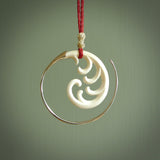 Hand carved pendants made from bone with sterling silver. NZ Pacific contemporary Koru pendants for sale online.