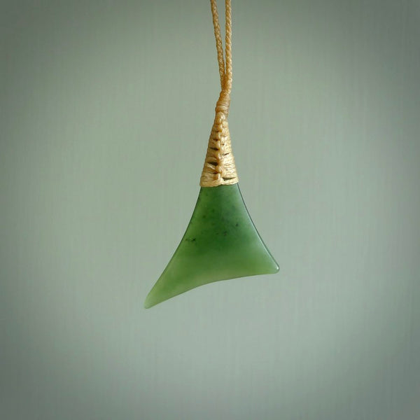 One only medium sized New Zealand jade drop pendant. Hand carved in New Zealand by Ric Moor, jade artist, for NZ Pacific.