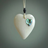 HAND CARVED HEART PENDANT. CARVED FROM BONE. PAUA HEART INSERT. HAND MADE BY NZ PACIFIC. HANDMADE JEWELLERY FOR SALE ONLINE.