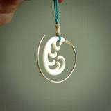 Hand carved pendants made from bone with sterling silver. NZ Pacific contemporary Koru pendants for sale online.