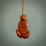 Hand carved stained bone meditating male figure pendant. Made from natural bone. Bone jewellery from the Pacific for sale online. Male pendant for men and women.