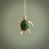 New Zealand Jade stone turtle in Sterling silver engraved casing. Hand carved jewellery made by NZ Pacific and for sale online. Moana, Ocean, jewellery hand carved in fire agate and Sterling Silver turtle necklace.