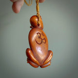 Hand carved stained bone meditating male figure pendant. Made from natural bone. Bone jewellery from the Pacific for sale online. Male pendant for men and women.