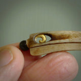 This is a hand carved rams horn huia bird beak pendant. It is made from rams horn with 24 carat gold leaf and jade toggle. This is a large sized necklace and is a very unique, one only, pendant that is a collectors piece. Hand carved by New Zealand artist, Sami.