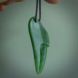 This large crab claw pendant is carved from a lovely deep green piece of New Zealand jade. It has an adjustable black coloured cord which can be slipped over the head and adjusted to the length that you prefer. Hand carved in New Zealand from our local jade by Kyohei Noguchi.