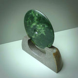 Hand carved New Zealand Marsden Jade Disc with Greywacke stand sculpture. Hand carved here in New Zealand by Ric Moor. This is a 'one only' sculpture, a beautiful display piece.