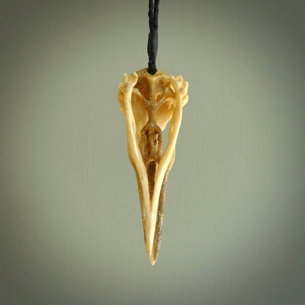 This is a hand carved deer antler huia bird skull pendant. It is made from deer antler, bone. This is a large sized necklace and is a very unique, one only, pendant that is a collectors piece. Hand carved deer antler huia skull necklace for men and women.