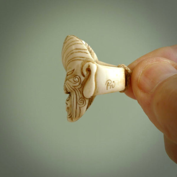 Hand carved Moko man face ring. Made from Red Deer antler in New Zealand. Unique Moko Man ring hand made from deer antler by master bone carver Fumio Noguchi. Spectacular collectable work of art, made to wear. One only ring, delivered to you at no extra cost with express courier.