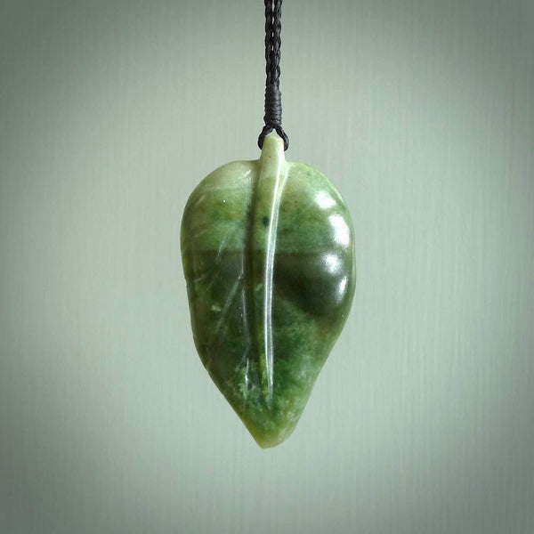 Hand carved New Zealand Jade leaf pendant with adjustable cord. This piece is a stand out work of creativity and skill and we love Raegan Bregmen's creations. Unique, one only, New Zealand made necklace for sale. Free shipping worldwide.