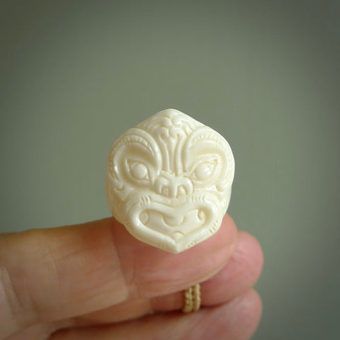 Hand carved natural bone wheku face ring. Natural bone ring with wheku face design. Hand made ring, delivered with international airmail. Postage is included. One only bone ring.