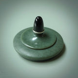 This shows the lid of the bowl - hand carved in Wyoming Green and Black jades.