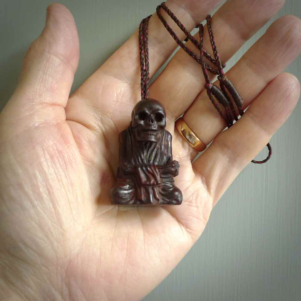 Red Jasper Stone skeleton Monk pendant. Handmade jade jewellery made by NZ Pacific and for sale online. Jasper stone skeleton man/monk for men and women. Unique art to wear from NZ Pacific.