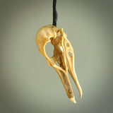 This is a hand carved deer antler huia bird skull pendant. It is made from deer antler, bone. This is a large sized necklace and is a very unique, one only, pendant that is a collectors piece. Hand carved deer antler huia skull necklace for men and women.