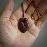 This is a handcarved love heart pendant made from a gorgeous and striking piece of red jasper stone. This is a superbly carved and very unique piece if custom jewellery. For sale online from NZ Pacific. Two sizes available; Medium and Large.