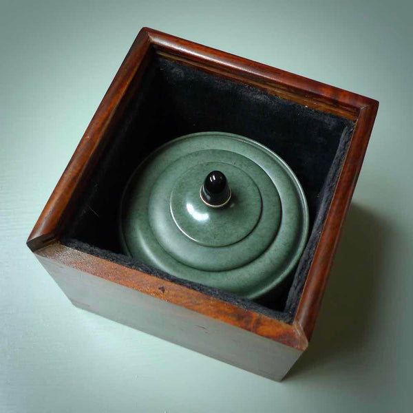 This shows th jade bowl nestled in the Rosewood wooden box.