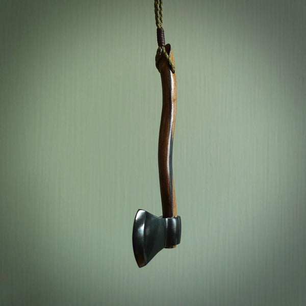 A striking hand carved axe pendant that we've called the Lumberjill. These are carved with a jade head and a hardwood handle. The cords are hand plaited in our waxed polyester which is robust, strong and durable. We ship these worldwide with DHL express courier.