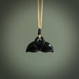 Hand carved black jade whaletail design. Whaletail koru pendant. Hand made jade jewellery for sale online.