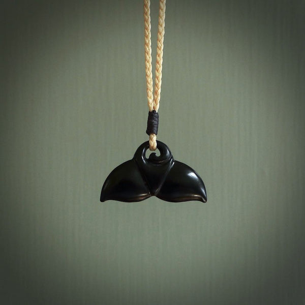 Hand carved black jade whaletail design. Whaletail koru pendant. Hand made jade jewellery for sale online.