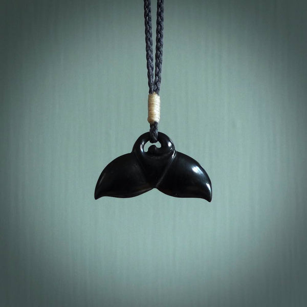 Hand carved black jade whaletail design. Whaletail koru pendant. Hand made jade jewellery for sale online.