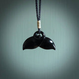 Hand carved black jade whaletail design. Whaletail koru pendant. Hand made jade jewellery for sale online.