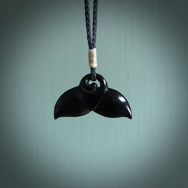 Hand carved black jade whaletail design. Whaletail koru pendant. Hand made jade jewellery for sale online.