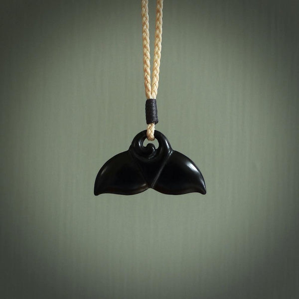 Hand carved black jade whaletail design. Whaletail koru pendant. Hand made jade jewellery for sale online.