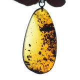This pendant is handcrafted from rare Burmese amber. We supply these with a sterling silver chain. It is a graceful and very interesting piece that will attract admiration and comment.