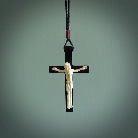Hand carved black jade crucifix pendant. The cross has been carved from Australian black jade and the Christ from Woollyy Mammoth Tusk. This is a beautiful crucifix that has been handmade by NZ Pacific. For sale online and shipping is free.