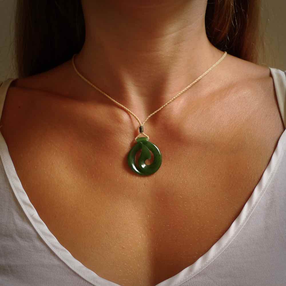 Jade matau or hook pendant. Carved from New Zealand pounamu in New Zealand. Hand carved jade jewellery for sale online.