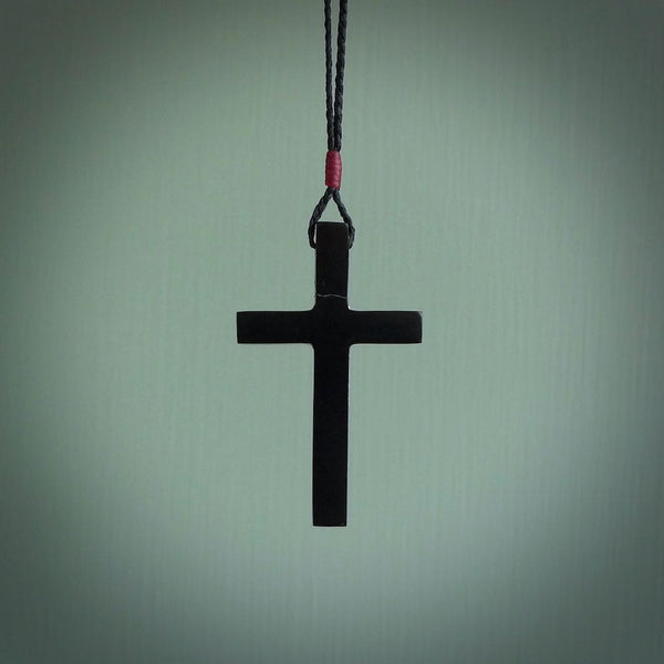 This picture shows the back side of a hand carved black jade crucifix pendant. The cross has been carved from Australian black jade and the Christ from Woolly Mammoth Tusk. This is a beautiful crucifix that has been handmade by NZ Pacific. For sale online and shipping is free.