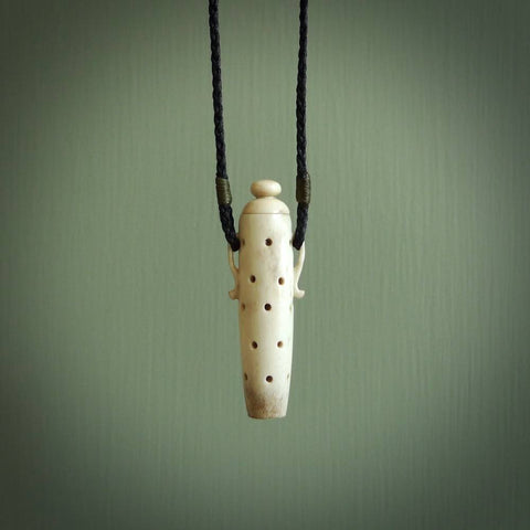 Essential oil dispenser. Hand carved bone urn. Used to dispense essential oils. Bone jewellery hand made in New Zealand by NZ Pacific. This is a lovely necklace made for lovers of essential oils.