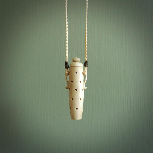 Essential oil dispenser. Hand carved bone urn. Used to dispense essential oils. Bone jewellery hand made in New Zealand by NZ Pacific. This is a lovely necklace made for lovers of essential oils.