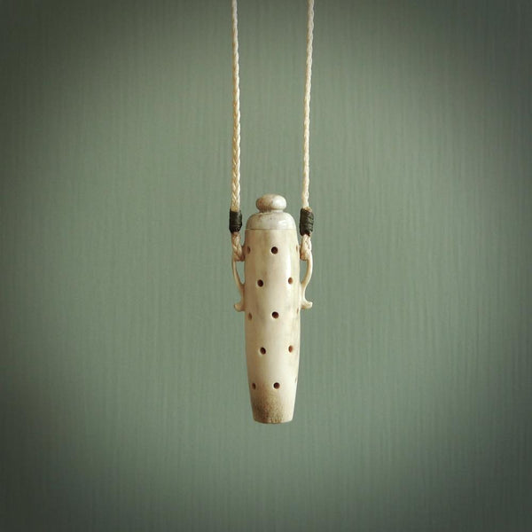 Essential oil dispenser. Hand carved bone urn. Used to dispense essential oils. Bone jewellery hand made in New Zealand by NZ Pacific. This is a lovely necklace made for lovers of essential oils.