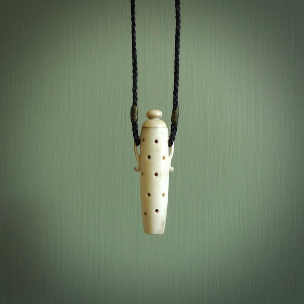 Essential oil dispenser. Hand carved bone urn. Used to dispense essential oils. Bone jewellery hand made in New Zealand by NZ Pacific. This is a lovely necklace made for lovers of essential oils.