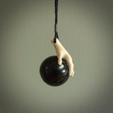 This is a very cool pendant that we've had carved for all you Basketball fans. The DUNK is a pendant with a woolly mammoth tusk hand holding a black jade basketball. We provide this on an adjustable black cord, and we ship worldwide. A very cool pendant, different, edgy and very wearable.