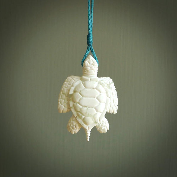Hand carved white onyx turtle pendant. Unique handmade jewellery for sale online. Carved by NZ Pacific - moana jewellery.