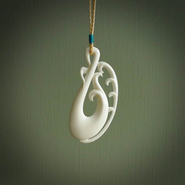 Hand carved bone koru pendant. Carved for NZ Pacific by Yuri Terenyi. Unique bone jewellery for sale online.