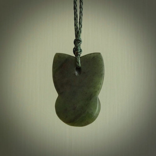 Hand carved New Zealand Jade Pounamu Wheku face pendant. Carved from New Zealand Jade by NZ Pacific. Hand crafted Jade jewellery for sale online. Pacific carving pendant, striking and unique delivered to you with Express Courier at no extra cost.